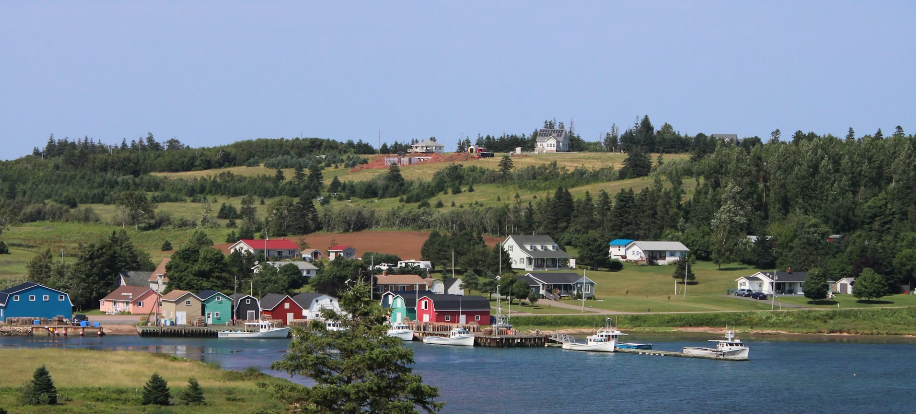 Golf course on Prince Edward Island with red sandy soil and rolling green fairways